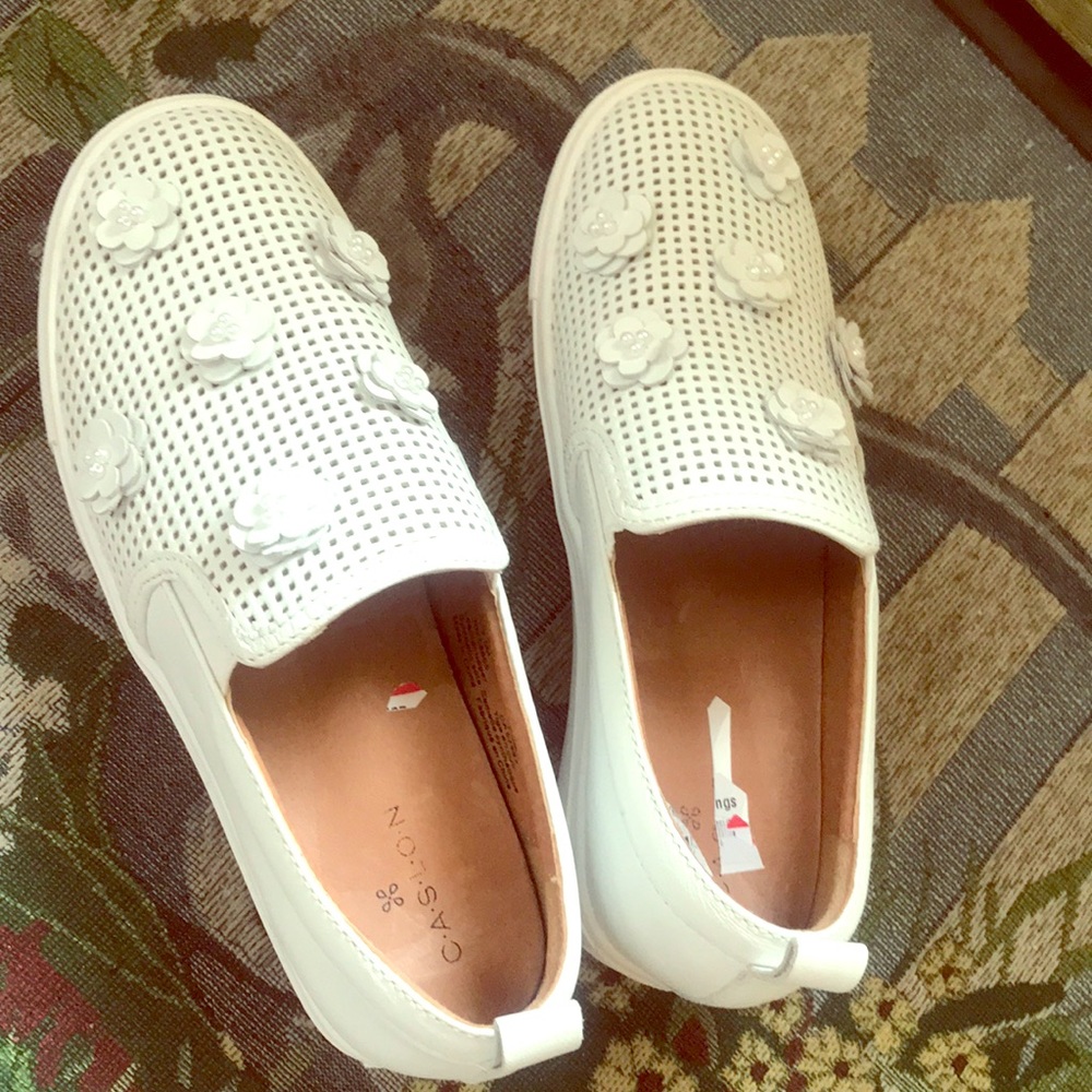 White leather slip ons